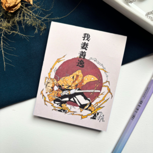 A7 Zenitsu Agatsuma Demon Slayer Kimetsu no Yaiba tear-off memopad with illustrated anime cover art featuring lightning motifs, on a clean aesthetic desk surface