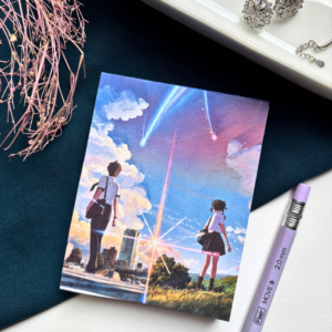 A7 Your Name Kimi no Na wa anime tear-off notepad with illustrated cover art featuring a twilight sky and comet, placed on a clean aesthetic desk surface