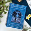 A4 spiral notebook with a midnight-blue "Moonlit Nights" cover featuring an illustrated starry forest path with a lone figure and lanterns, framed with sparkle and crystal details, and a reflective quote at the bottom.