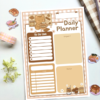 A5 daily planner with a pink gingham border featuring a cocoa kitten illustration, including sections for to-do list, urgent tasks, time/event schedule, and notes.