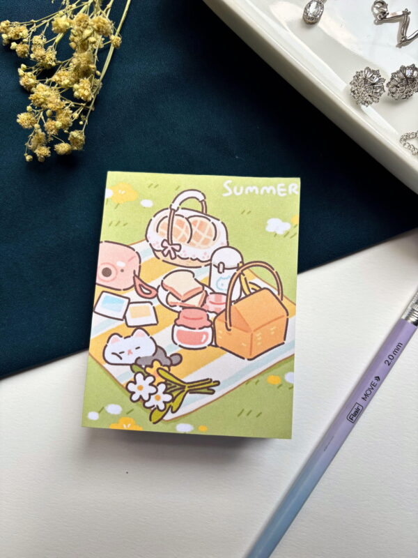A7 memopad with a cute kitten summer picnic illustrated cover.