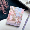 A7 memopad with a cute pastel bunny and town-themed illustrated cover.