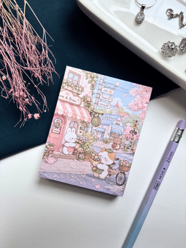 A7 memopad with a cute pastel bunny and town-themed illustrated cover.