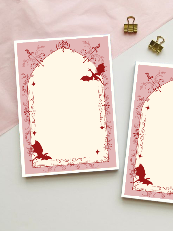 Fantasy-themed notepad with a rose-red gothic arch border featuring dragons, crossed swords, and ornate filigree detailing, with a blank cream centre for writing.