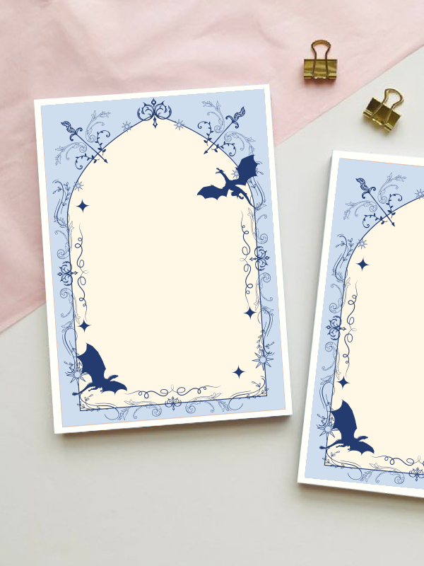 Fantasy-themed notepad with a rose-red gothic arch border featuring dragons, crossed swords, and ornate filigree detailing, with a blank cream centre for writing.