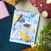Modern girl memopad featuring an illustrated girl with a tote bag, books, flowers, and lemons, aesthetic lifestyle-themed notepad design.