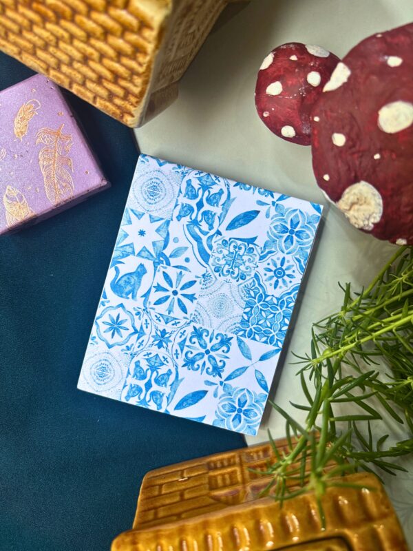 Blue Moroccan tile memopad featuring an intricate geometric mosaic pattern in rich blue tones, aesthetic patterned notepad design.