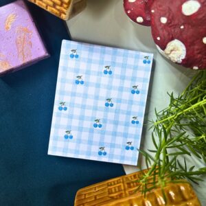 Blue cherry checkered memopad featuring cute cherry illustrations on a blue checkered pattern background, aesthetic notepad design.