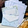 Vintage princess-themed letter set with 4 printed letter sheets and 2 matching printed envelopes featuring ornate, fairy tale-inspired illustrations.