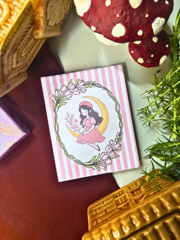 Moonfairy memopad featuring a pastel pink illustration of a fairy girl sitting on a crescent moon, aesthetic celestial-themed notepad design.