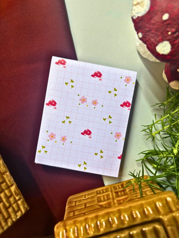 Mushroom pink checkered memopad featuring cute mushroom illustrations on a pastel pink checkered background, cottagecore aesthetic notepad design.