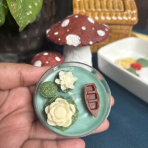 jumbo lotus tealight candle with detailed petals, glowing softly