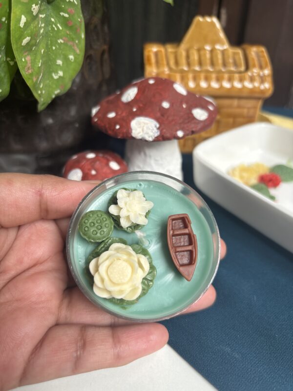 jumbo lotus tealight candle with detailed petals, glowing softly